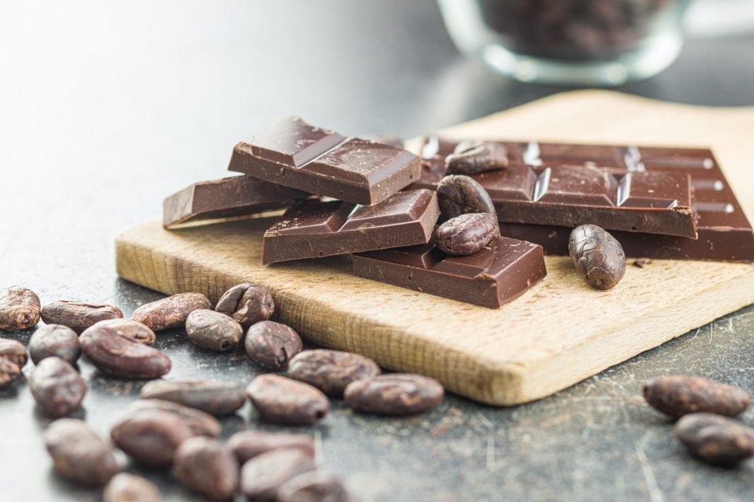 Dark chocolate bar and cocoa beans - high in flavanols